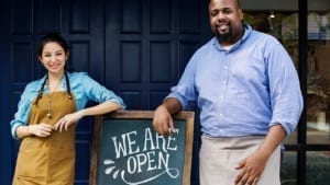 Employees Standing by We are Open Sign